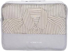 CACATUA packing cube large clothing bag with mesh window showing folded striped shirts inside — "To Travel To Live" travel organiser.